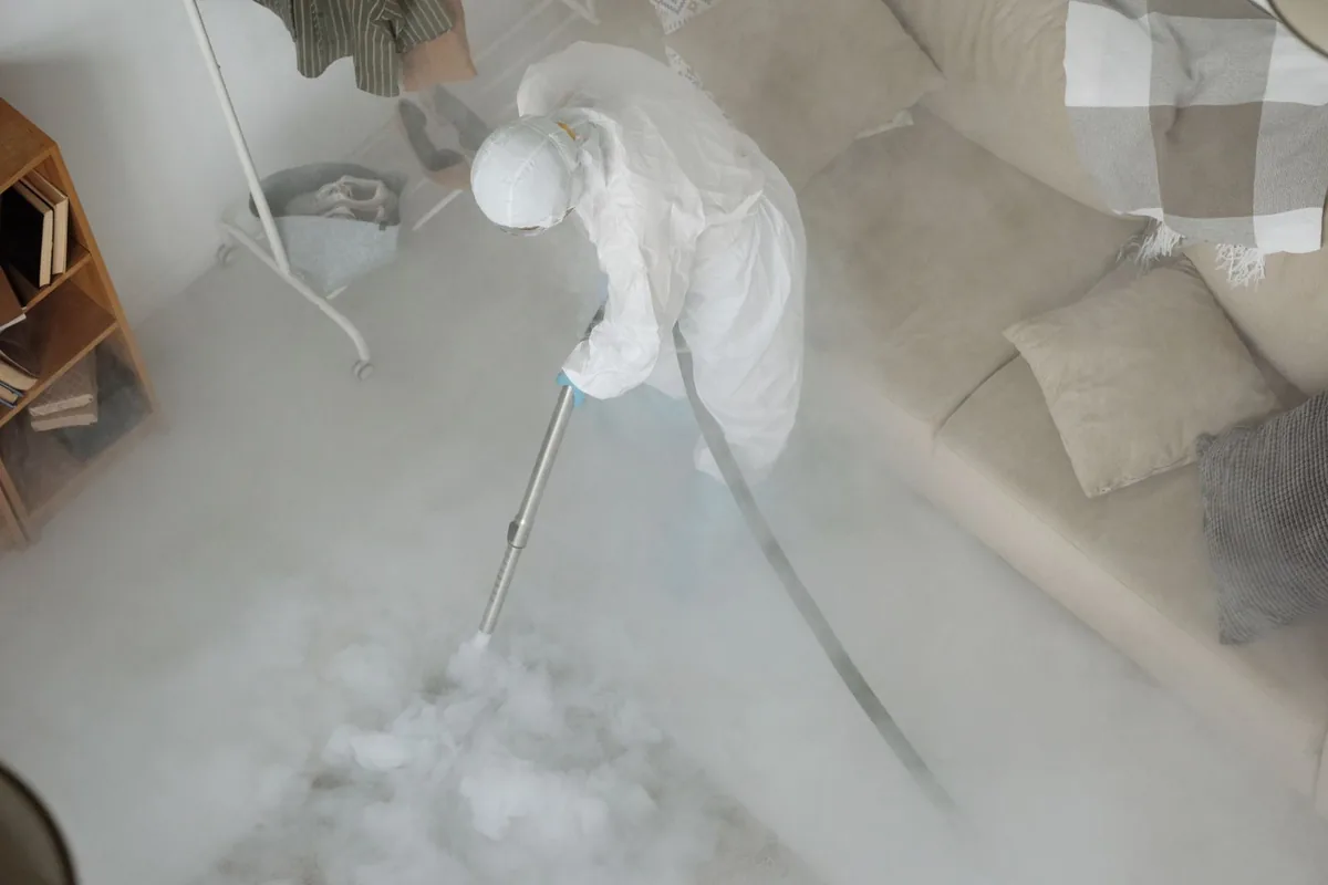 Biohazard cleanup technician in protective equipment, Five Corners, WA